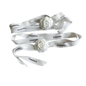 Two Chanel ribbons with Camellias